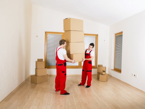 Loading boxes into a van for transport in Gallowscorner